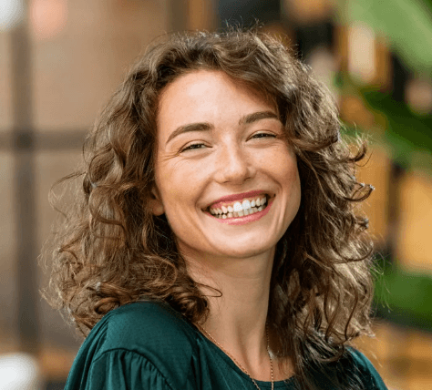 A chamber member smiling at a networking event